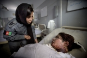 KABUL,AFGHANISTAN-JUNE 2009- Sidiqa Sultani, 25, policewoman based in Police station 6 in Kabul, is investigating the case of 17-year-old girl who had 85% of her body burnt. Sidiqa at Esteklal hospital is trying to understand what happened by questioning the family, to see if the husband or anybody else is guilty or responsable of this drama.( Photo by Veronique de Viguerie/Getty Images for Marie-Claire France)