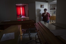 MULHOUSE, FRANCE- 5 APRIL 2020: Catherine, ceremony master is getting emotional with all the coffins everywhere, in each room they have, they have coffins everywhere, all of victims of Covid. (Picture by Veronique de Viguerie/Getty Images)