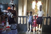 PORT-AU_PRINCE, HAITI-NOV, 2014: Valentine Calixte, beneficiaire de Pamis, prepare les dejeuners de ses enfants avant qu'ils ne partent a l'ecole. L'ecole est l'une des depense premiere des foyers en Haiti. (Photo by veronique de Viguerie/Reportage by getty images).
