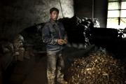 BAOTOU, CHINA-FEBRUARY, 2011 : A worker is holding a piece of metal alloy made of metals and rare earth, easy to export  by-passing the quotas regulations. (Photo by Veronique de Viguerie/Reportage by Getty Images)