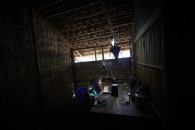 SITTWE, MYANMAR- JUNE, 2015:Rohingya people are not allowed to work, neither to get out of the camp. Many men left to work abroad and send some money back to their families in Myanmar. Wives are speaking sporadicly to their husbands, sons via skype in very rudimentar internet cafes. (Picture by Veronique de Viguerie/Reportage by getty Images).