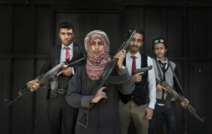 SANAA, YEMEN- NOV, 2017: 17-years-old Amat Allah Hassan, Prime Minister of the children government, is fighting corruption, the use of child soldiers and child marriage. She works with some other child ministers, from left, Ahmed Abdalh Al Showpi (17) minister of health, Amat, Asad Dahak (18) minister of roads, highways and public work and Ahmed Hani Aman (16) minister of fishing. They carry weapons to protect themselves as they are fighting against corruption, using social medias to uncover important people bad actions etc... And they are trying to help anyone who ask for it. For example a man ask Ahmed health minister some help for his ill son. Together with other child ministers they made a campaign and rise enough money for the man son to be cured. Amat is scared of nobody and speaks with all sides, Salah, Houthis and even Hadi's side. She wish to become a president and my guess is that she might well become one. She is very connected, respected and appreciated with a very very big mouth... Amat, 17 ans, premier ministre du ministÃ¨re des enfants qui compte 33 membres. Ils luttent contre la corruption, le recruitement des enfants soldats, les mariages prÃ©coces et bien d'autres problÃ¨mes de la societe Yemenite. Amat peut compter sur ses anges, Ahmed Abdalh Al Showpi (17) ministre de la santÃ©, Asad Dahak (18) ministre des routes et des batiments publics et Ahmed Hani Aman (16) ministre de la pÃªche. Ils sont toujours armÃ©s.