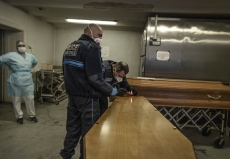 MULHOUSE, FRANCE- 28 MARCH 2020: Policemen are sealing the coffin of  awoman who died of Covid 19 before it's taken off by Jeremy Walter.  (Picture by Veronique de Viguerie/Getty Images)