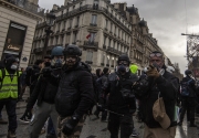 PARIS, FRANCE - DECEMBER 01: Clashes between the police and the Yellow Vests nearby the Champs ElysÃ©es on December 8, 2018 in Paris, France. The demonstrators, known as "gilets jaunes" or "yellow vests," have protested across France for the last two weeks, demanding a reduction in fuel prices. French law requires drivers to carry yellow vests in case of accident. (Photo by Veronique de Viguerie/Getty Images for the Washington Post)