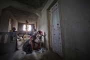 PORT-AU_PRINCE, HAITI-NOV, 2014: Valentine Calixte, beneficiaire de Pamis, prepare sa fillette pour aller a l'ecole. L'ecole est l'une des depense premiere des foyers en Haiti. (Photo by veronique de Viguerie/Reportage by getty images).
