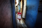 PORT-AU_PRINCE, HAITI-NOV, 2014: Anaika avait 20 jours lors du tremblement de terre. Elle a perdu son bras droit lorsque sa maison s'est ecrasee sur elle et sa maman, Marie-Denise. Aujourd'hui, dimanche, elle part a la messe. (Photo by veronique de Viguerie/Reportage by getty images).
