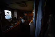 GREEN WATERS, NEWFOUNDLAND-JUNE, 2014: Captain Nelson Pittman is reading a newspaper in the kitchen on board. (Picture by Veronique de Viguerie/Reportage by Getty Images).