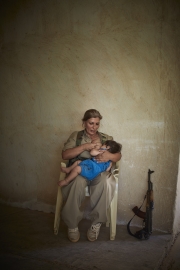 KURDISTAN, IRAQ-SEPTEMBER, 2014: Shaista Rarmani (36) is breastfeeding her son Saamal (10-months-old).  A militia part of the democrat Parti of the iranian faction of the Kurdish Guerilla. Picture by Veronique de Viguerie/Reportage by Getty Images)