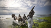Abdul Hassan (39) carrying a RPG, nicknamed "the one who never sleeps" is one chief of the pirat's group called the coasty guards. This group was made 3 years ago and has 350 men and about 100 speed boats. This year (2008), the group attacked 29 ships and got 10 millions US dollars out of it. Abdul Hassan got for himself, 350 000 US dollars. Abdul Hassan met us on a beach near Hobyo, on the border between Galmudu and Puntland states, with a small crew before to go on an attack to another ship. Hobyo, Somalia. Monday, 27th, October, 2008.