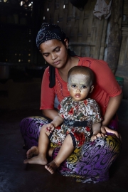 SITTWE, MYANMAR- JUNE, 2015: Masonya Camp. Most of the people living in this camp were used to live in Sitwee city centre. They wer displaced there after the 2012 violences. Ranou (21) was a buddhist from a rahkine family. She decide to marry her former rohingya neighbourg, Mohamad in 2013. Now she is converted and considered as a rohingya herself, she cannot get out of the camp, neither to work or even visit her parents to present their 18-months-old daughter. (Picture by Veronique de Viguerie/Reportage by getty Images).