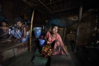 SITTWE, MYANMAR- JUNE, 2015:  Bodouba Camp. Rahana (45), mother-of-nine is crying over the disappearance of her 19-years-old duaghter and her 12-years-old son. They both got hooked by some brokers. The son called them a few weeks ago, he was in the hands of traffickers in Thailand who asked for 600 USD to release him. They have no news of the girl. (Picture by Veronique de Viguerie/Reportage by getty Images).