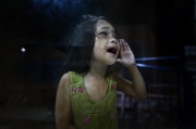 MANILA, PHILIPPINES - OCT, 2016: A girl outside a police station is shouting to her dad in the cell of the police station.  (Picture by Veronique de Viguerie/ Reportage by Getty Images).