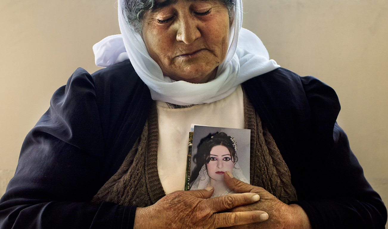 SINJAR, KURDISTAN, IRAQ- FEBRUARY, 2016: Wansa Khalaf (55), a Ã©tÃ© enlevÃ©e avec ses 4 fils, ses 3 filles et ses 11 petit enfants. Elle a Ã©tÃ© "rachetÃ©e" il y a quelques mois mais tous les membres de sa famill sont encore aux mains de Daech ou morts. Elle a vu la photo de sa fille circulait sur les reseaux de Daech oÃ¹ elle etait proposait Ã  la vente. Wansa n'ose pas rentrer chez elle, elle vit avec les combattantes de YBS Ã  leur base.(picture by Veronique de Viguerie/ Reportage by Getty Images )